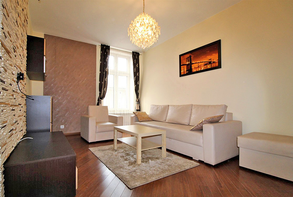 widok z innej strony na luksusowy salon w ekskluzywnym apartamencie do wynajmu w Krakowie