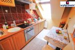 fragment umeblowanej i zabudowanej kuchni w ekskluzywnym apartamencie w Szczecinie na sprzedaż