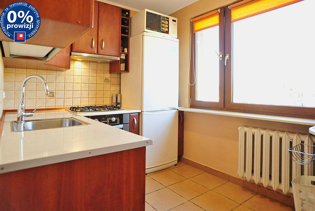 widok na umeblowaną kuchnię w luksusowym apartamencie w okolicach Katowic na sprzedaż