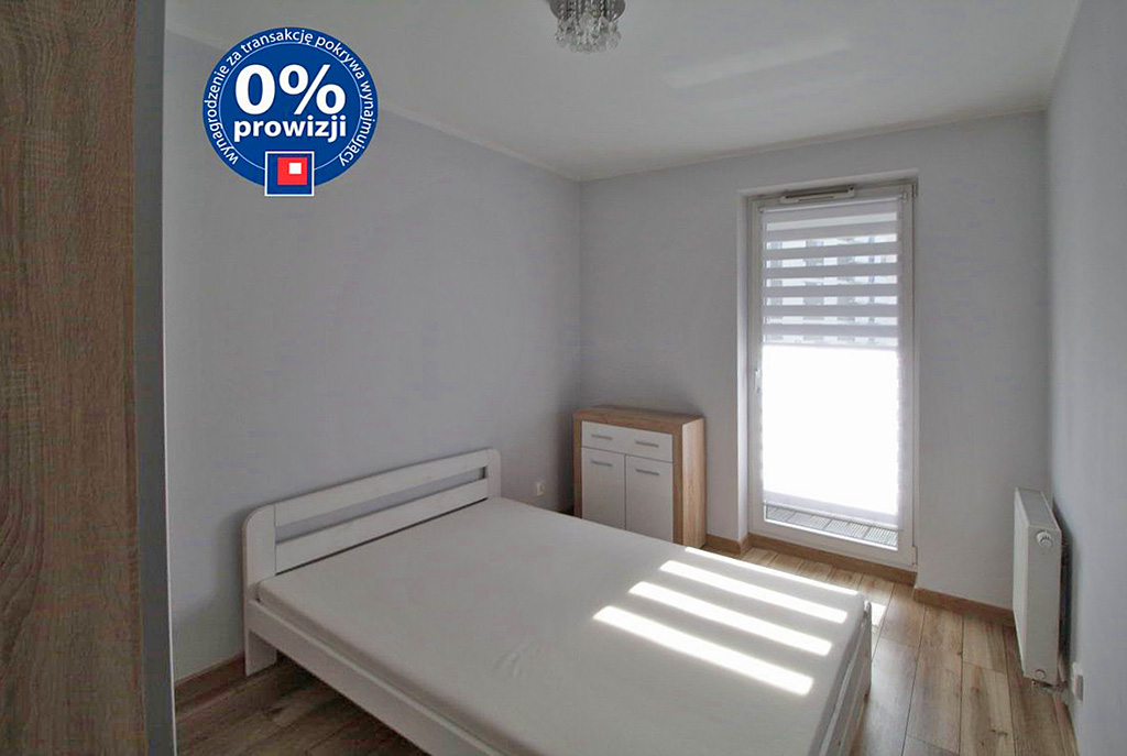 zdjęcie prezentuje zaciszną, prywatną sypialnię w luksusowym apartamencie w Krakowie na wynajem