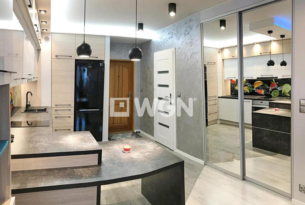 widok od strony salonu na luksusowe wnętrze ekskluzywnego apartamentu do wynajmu w Szczecinie