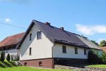 widok od strony ogrodu na ekskluzywną willę do sprzedaży na Mazurach