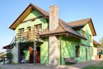 widok od strony ogrodu na luksusową willę do sprzedaży nad morzem