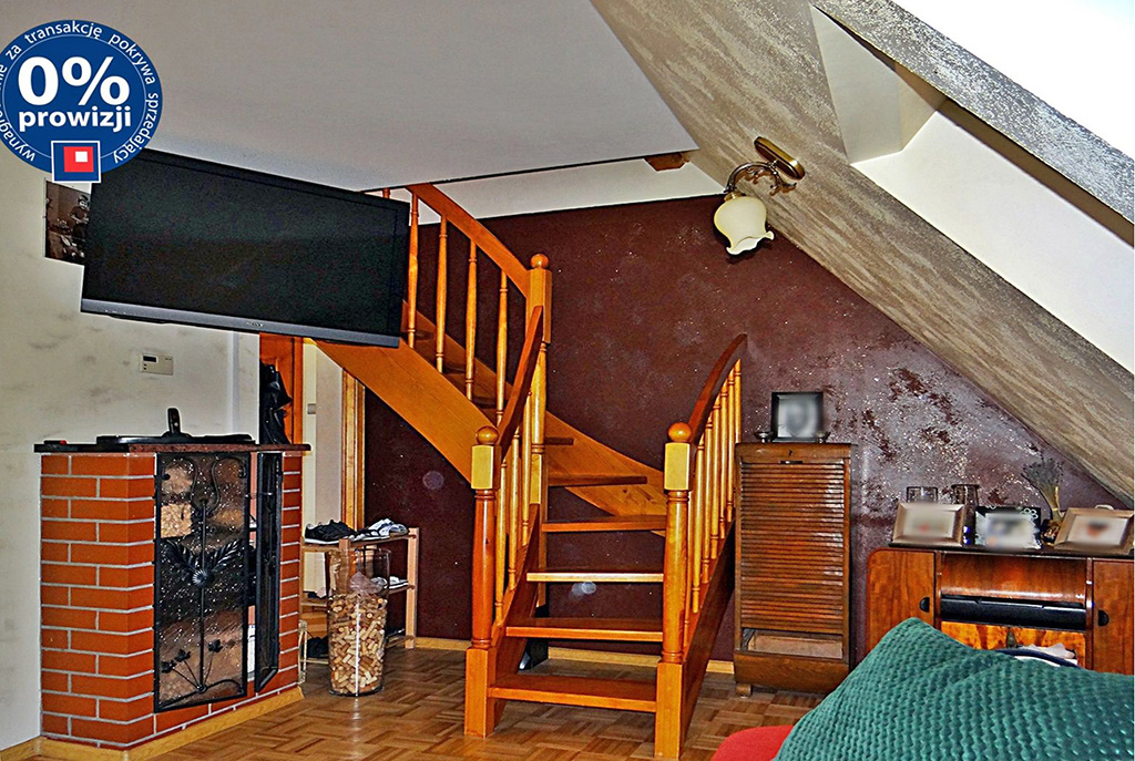 widok na ekskluzywny salon z kominkiem w luksusowym apartamencie do sprzedaży w Bolesławcu