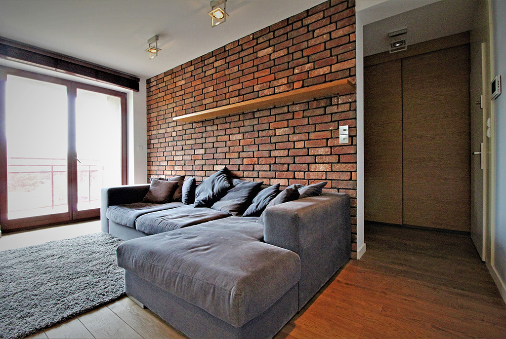 fragment komfortowego salonu w luksusowym apartamencie do wynajmu w Krakowie