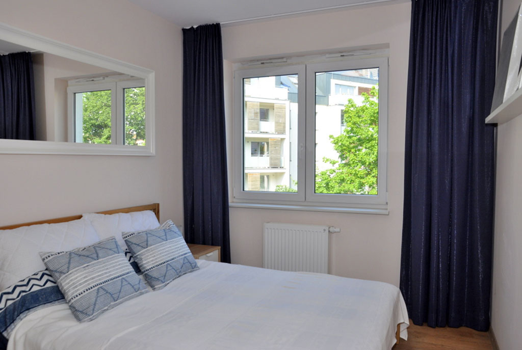 elegancka sypialnia w luksusowym apartamencie we Wrocławiu na wynajem