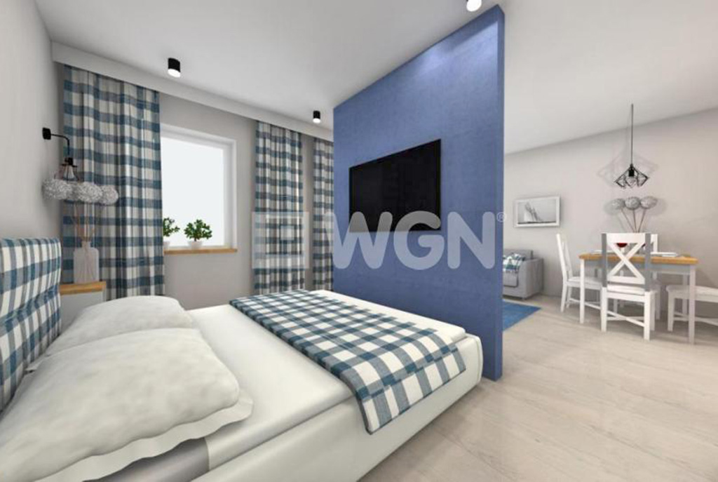 nowoczesna sypialnia i aneks kuchenny w ekskluzywnym apartamencie do sprzedaży nad morzem