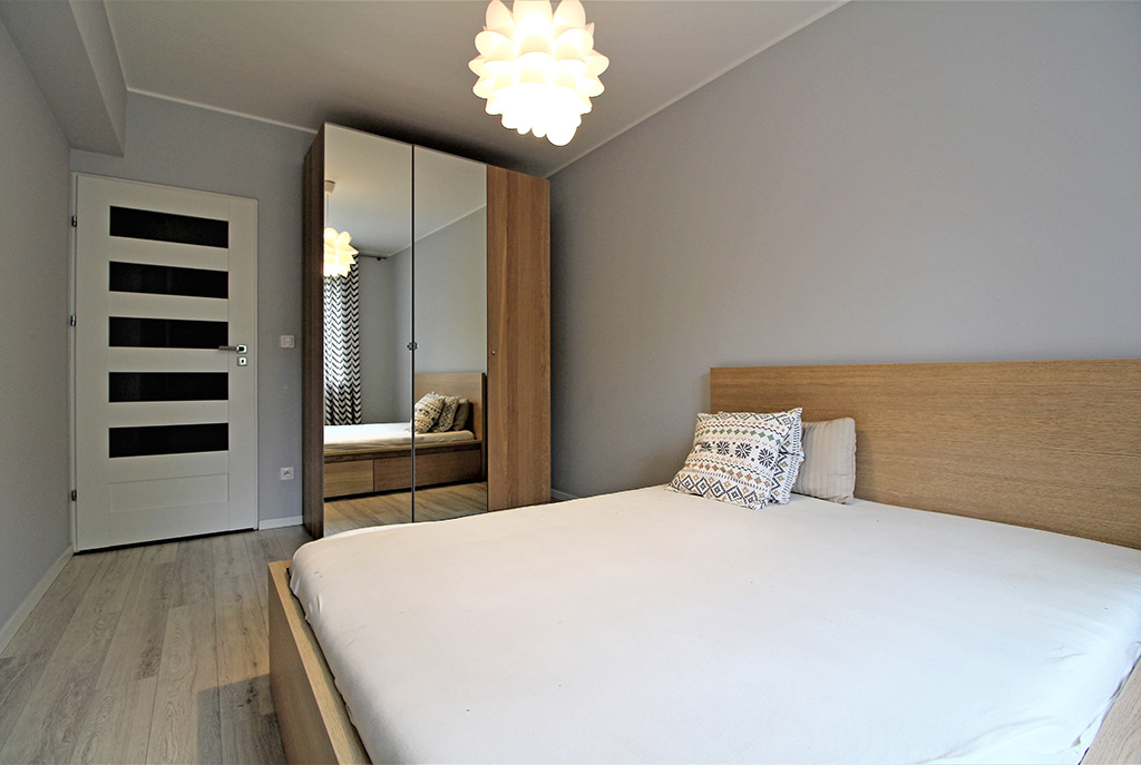 wytworna, zaciszna sypialnia w luksusowym apartamencie w Krakowie na wynajem