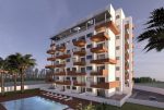 widok na basen i apartamentowiec w Hiszpanii (Guardamar del Segura), w którym znajduje się oferowany na sprzedaż luksusowy apartament