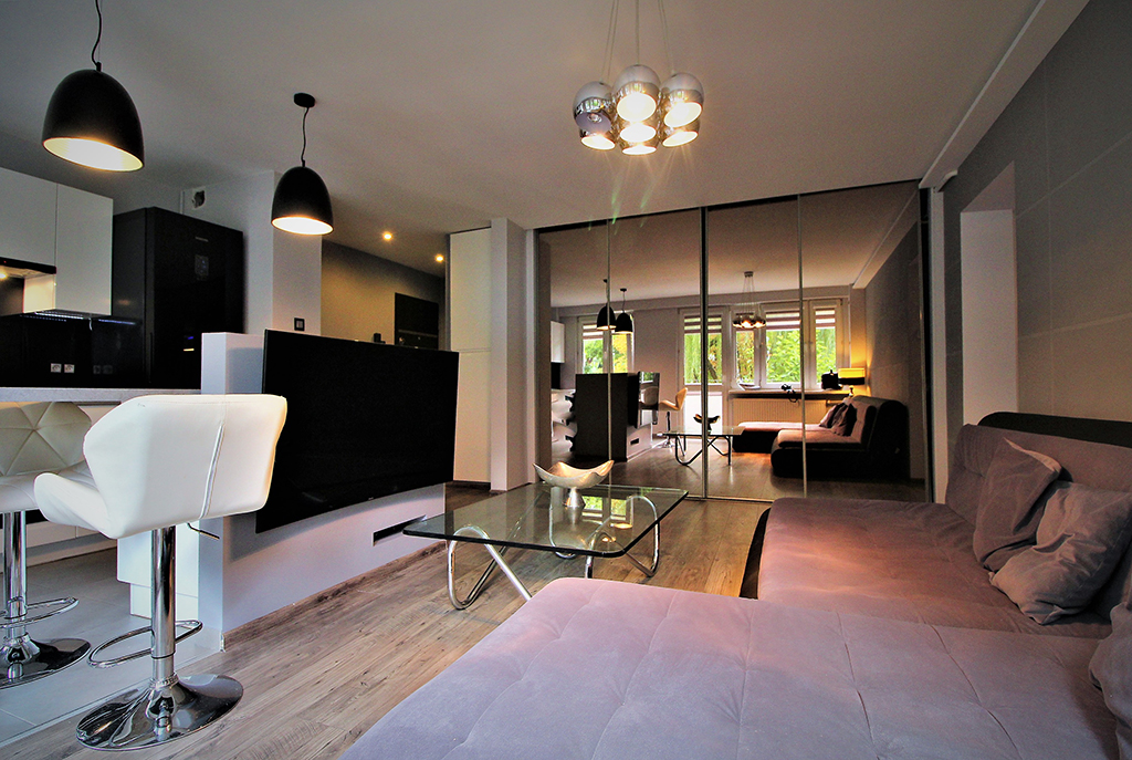 kameralne wnętrze salonu w ekskluzywnym apartamencie do sprzedaży w Krakowie