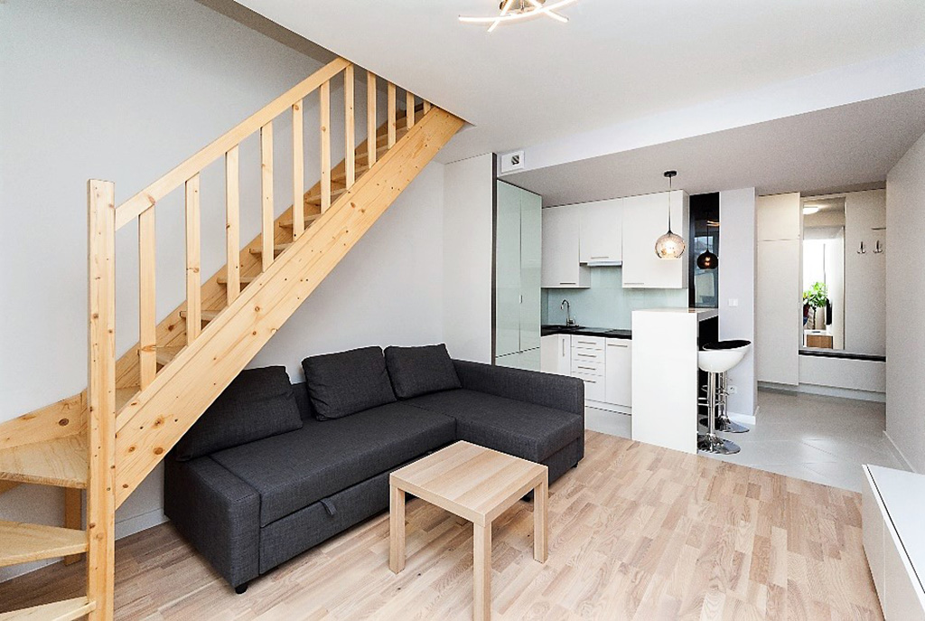 widok z salonu na aneks kuchenny w apartamencie do wynajęcia Kraków