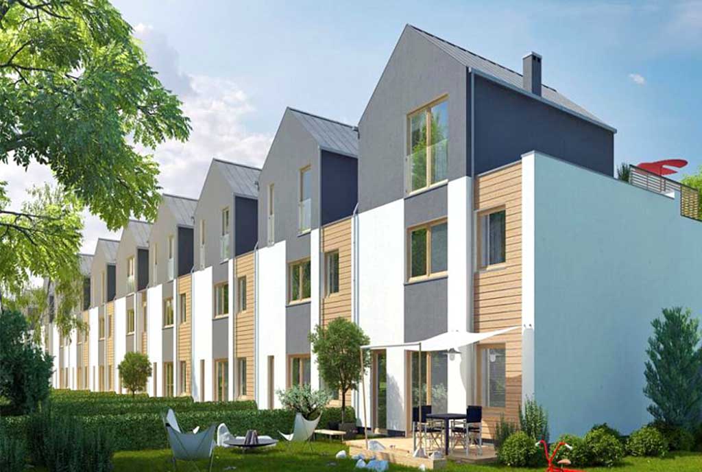 widok od strony ogrodu na budynek, w którym znajduje się oferowany na sprzedaż apartament Poznań (okolice)
