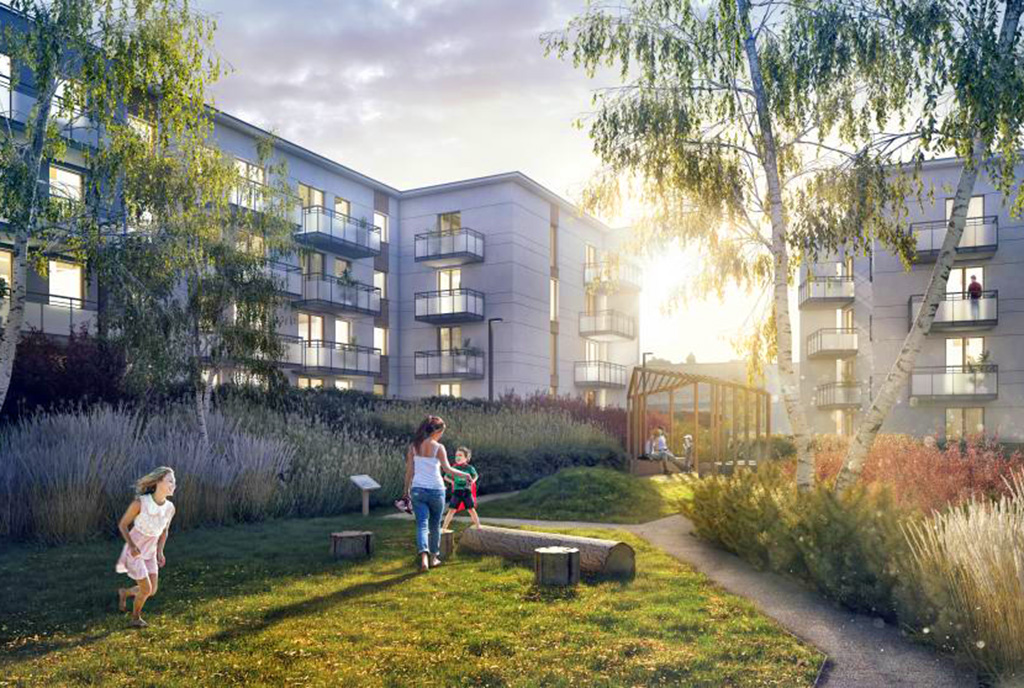 na zdjęciu osiedle skąpane w zachodzącym słońcu, gdzie znajduje się oferowany na sprzedaż ekskluzywny apartament