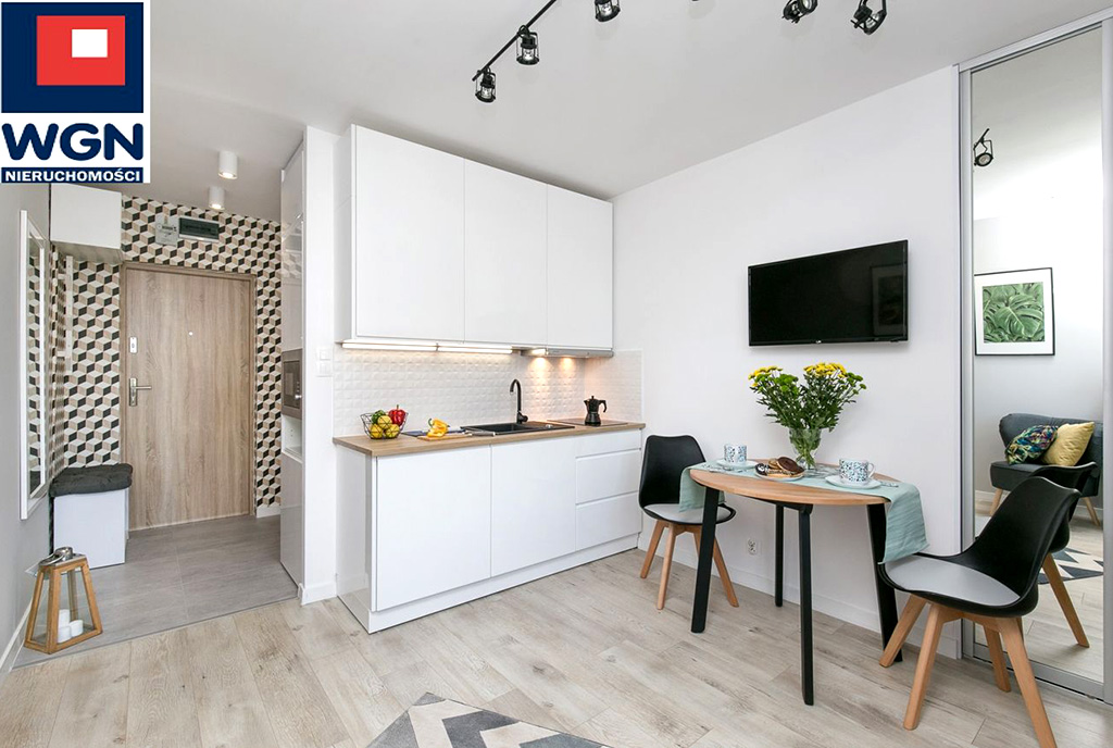 widok z salonu na aneks kuchenny w luksusowym apartamencie do sprzedaży Gdańsk