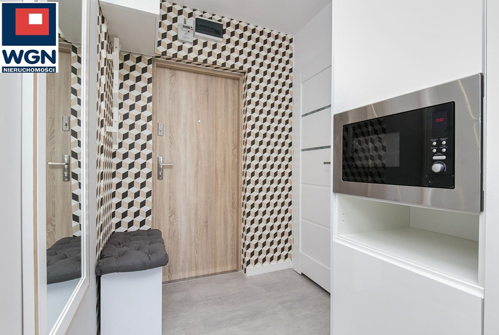 nowocześnie wyposażona i umeblowana kuchnia w luksusowym apartamencie do sprzedaży Gdańsk
