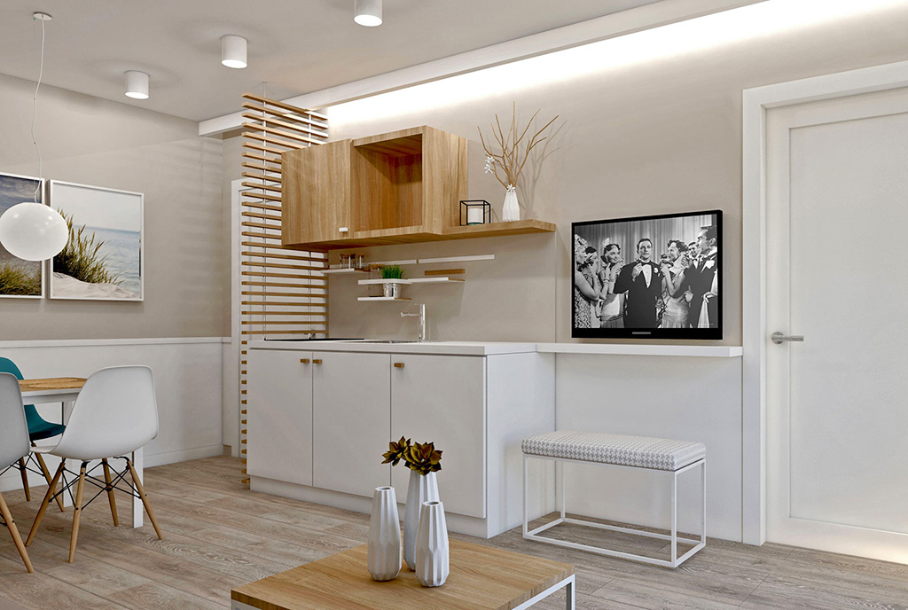 widok z salonu na aneks kuchenny w ekskluzywnym apartamencie do sprzedaży nad morzem