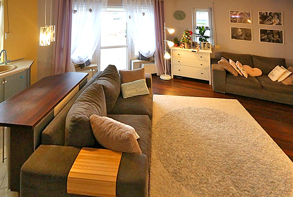 widok z innej perspektywy na luksusowy salon w ekskluzywnym apartamencie na sprzedaż Inowrocław