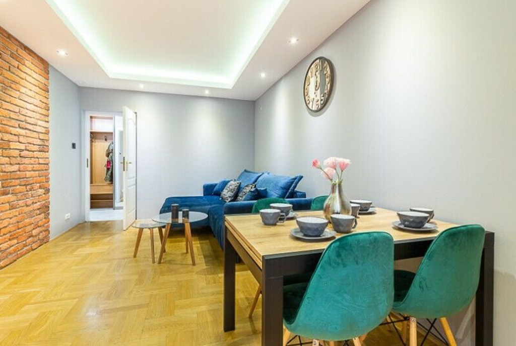 widok z salonu na jadalnię i wnętrze luksusowego apartamentu na sprzedaż Kraków