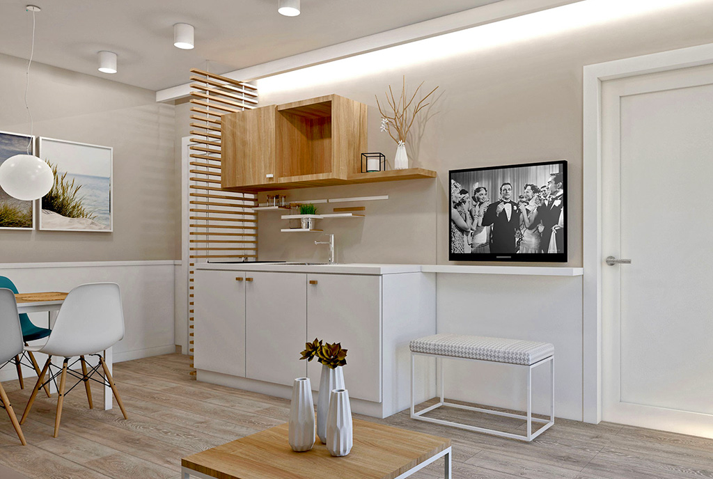 widok z salonu na aneks kuchenny w luksusowym apartamencie do sprzedaży nad morzem