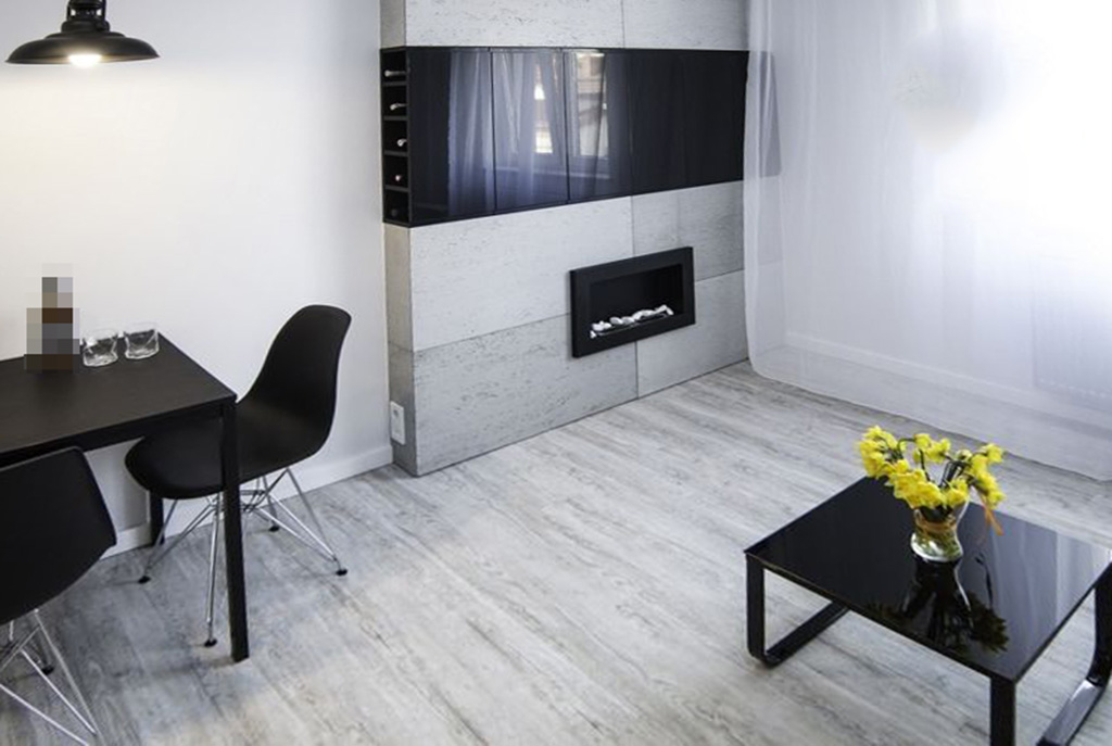 zbliżenie na kominek w luksusowym salonie w ekskluzywnym apartamencie na sprzedaż Kraków