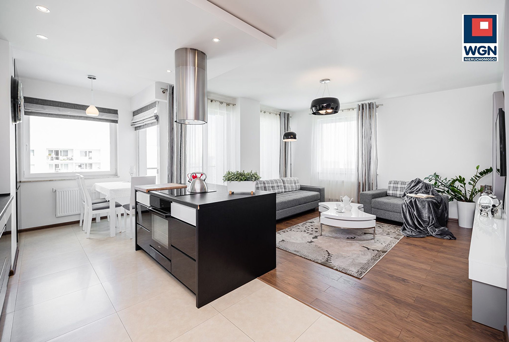 zdjęcie prezentuje komfortową jadalnię i kuchnię w ekskluzywnym apartamencie do sprzedaży Gdańsk