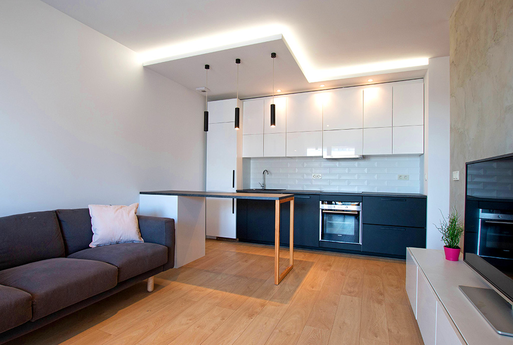 widok z innej perspektywy na luksusowy aneks kuchenny w ekskluzywnym apartamencie do sprzedaży Poznań
