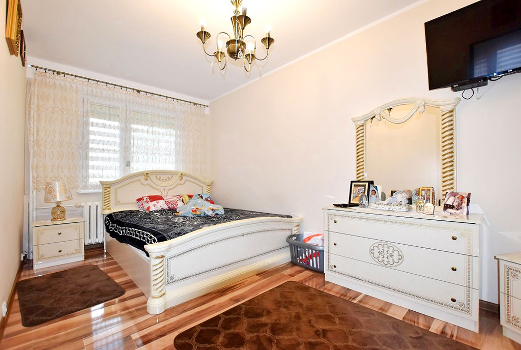 zaciszna sypialnia w luksusowym apartamencie na sprzedaż Inowrocław