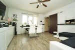 widok na jadalnię w luksusowym apartamencie na sprzedaż Elbląg
