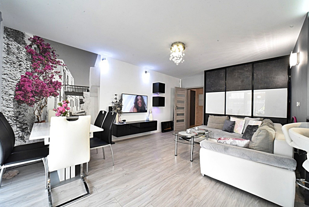 aranżacja w modnej bieli salonu luksusowego apartamentu do wynajęcia Bolesławiec