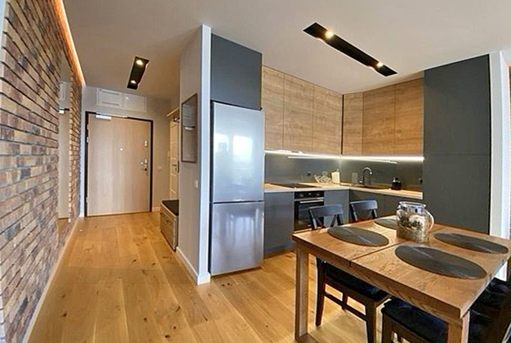 kuchnia w nowoczesnej zabudowie w luksusowym apartamencie do wynajmu Szczecin