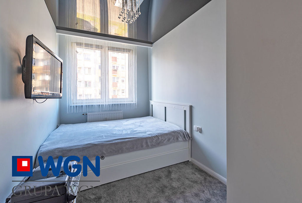widok na zaciszną sypialnię w luksusowym apartamencie do sprzedaży Elbląg