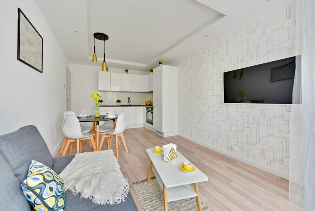 widok z salonu na aneks kuchenny w luksusowym apartamencie na sprzedaż Gdańsk