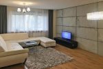zaprojektowany zgodnie z najnowszymi trendami pokój dzienny w luksusowym apartamencie na sprzedaż Wieluń