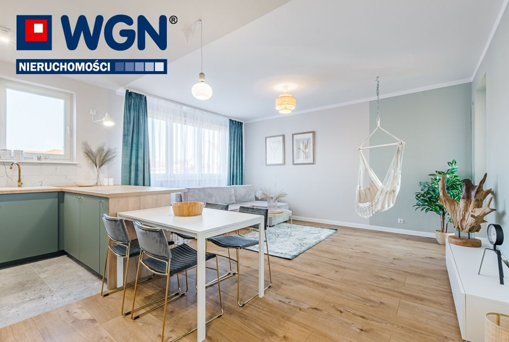 na pierwszym planie jadalnia w ekskluzywnym apartamencie na sprzedaż Gdańsk