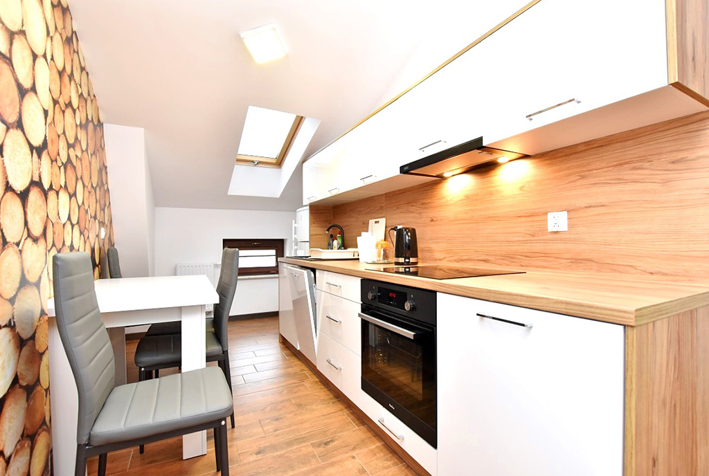 praktycznie urządzona kuchnia w ekskluzywnym apartamencie na wynajem Inowrocław