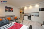 druga strona pokoju gościnnego w luksusowym apartamencie do sprzedaży Konin