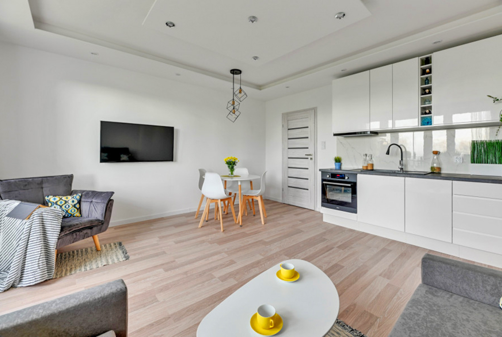 zbliżenie na pokój dzienny, jadalnię i aneks kuchenny w luksusowym apartamencie na sprzedaż Gdańsk