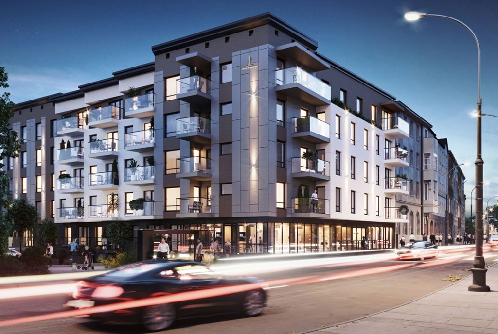 widok nocą od strony ulicy na apartamentowiec, gdzie mieści się oferowany na sprzedaż luksusowy apartament Legnica