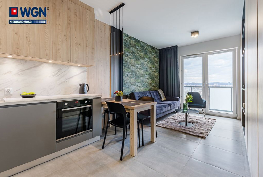 widok z aneksu kuchennego na salon w ekskluzywnym apartamencie do wynajmu Gdańsk