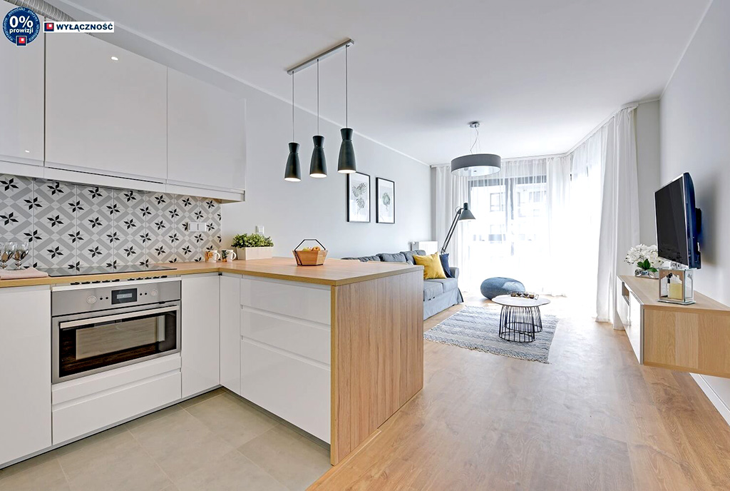 widok od strony aneksu kuchennego na salon w luksusowym apartamencie na sprzedaż Legnica