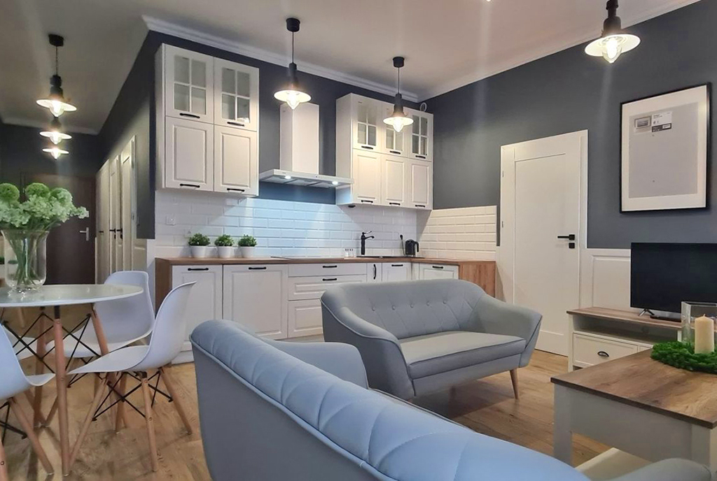 druga strona salonu w ekskluzywnym apartamencie na wynajem Wieluń