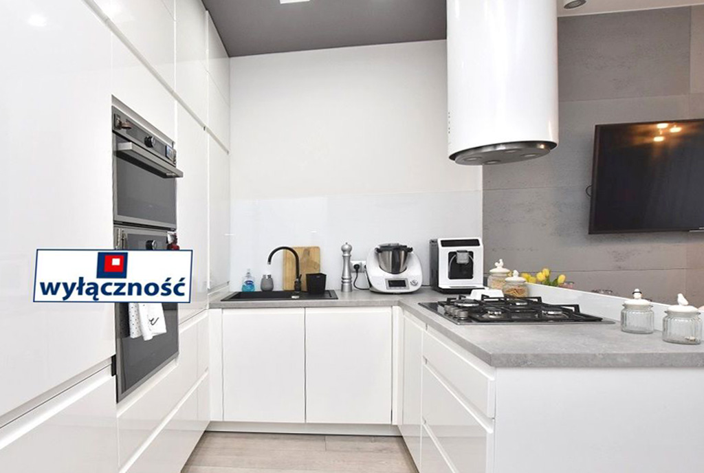 zaprojektowana zgodnie z najnowszymi trendami kuchnia w ekskluzywnym apartamencie do sprzedaży Inowrocław