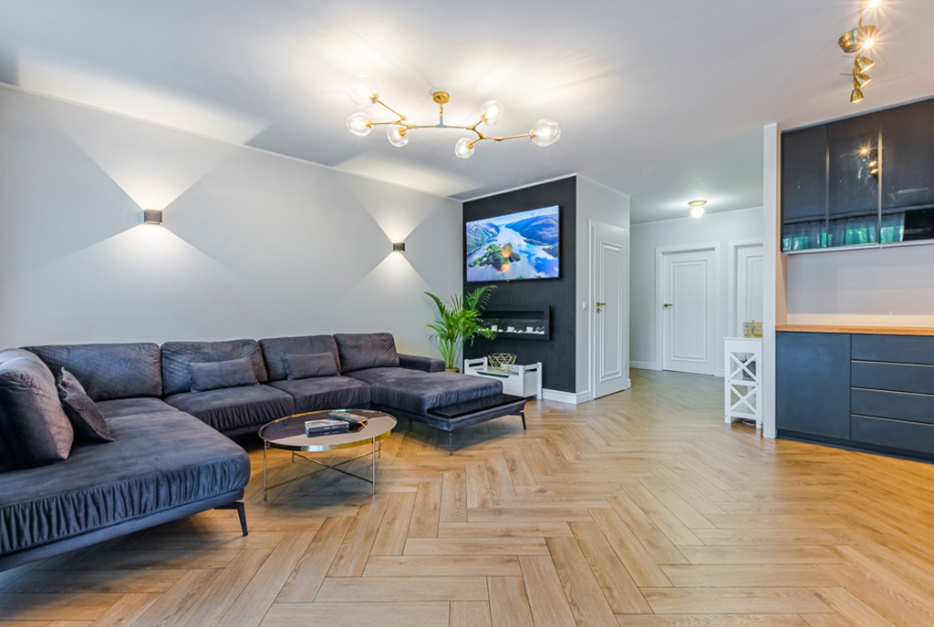 zaprojektowany zgodnie z najnowszymi trendami pokój dzienny w luksusowym apartamencie na sprzedaż Gdańsk