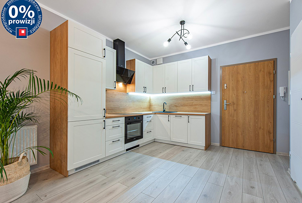 widok z salonu na aneks kuchenny w luksusowym apartamencie na sprzedaż Katowice (okolice)
