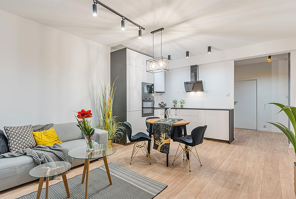 widok na jadalnię oraz aneks kuchenny w ekskluzywnym apartamencie na sprzedaż Gdańsk