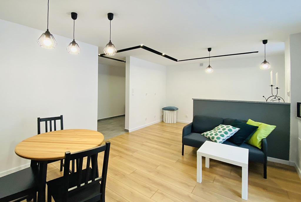przeciwległa strona salonu w luksusowym apartamencie na sprzedaż Katowice (okolice)