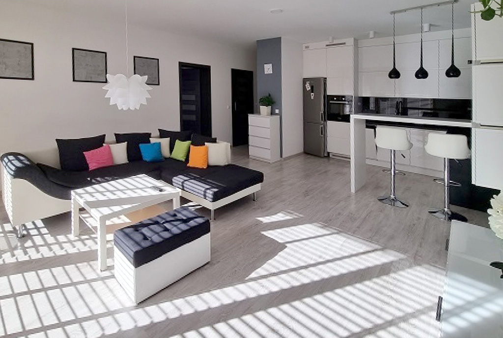 widok z pokoju gościnnego na luksusowe wnętrze ekskluzywnego apartamentu na wynajem Szczecin