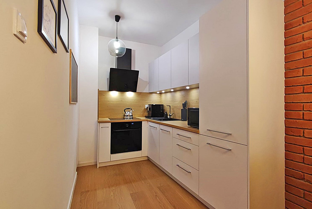 nowoczesna zabudowa kuchni w ekskluzywnym apartamencie do wynajmu Legnica