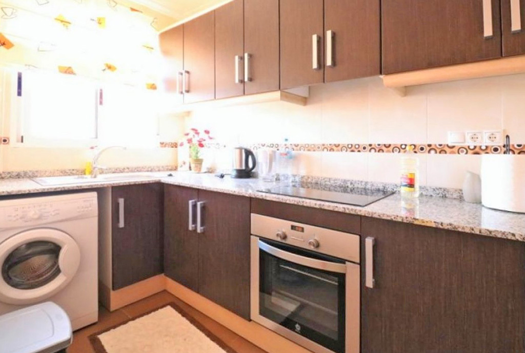 praktycznie zasbudowana kuchnia w ekskluzywnym apartamencie na sprzedaż praktycznie