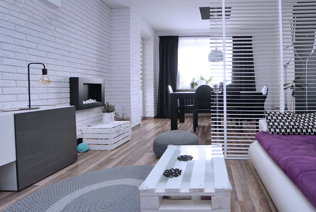 zaprojektowany w nowoczesnym designie pokój dzienny w luksusowym apartamencie na sprzedaż Konin